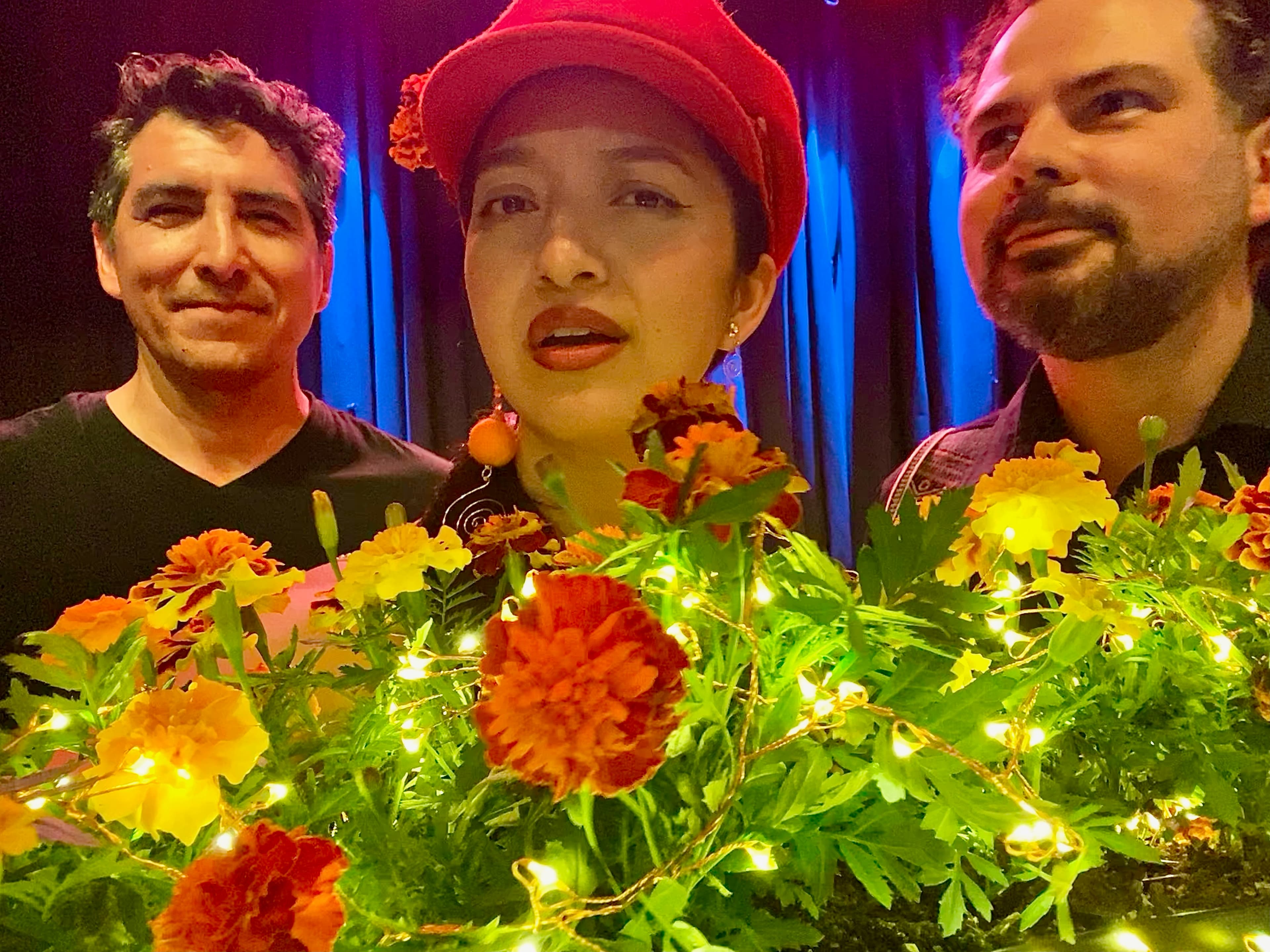 Trio Luminesse performing together with stage lights and flowers