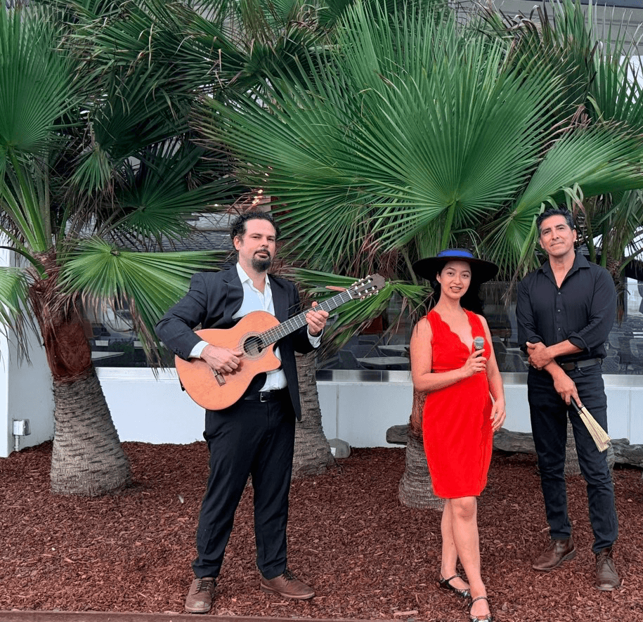 Trio Luminesse standing together among palm trees